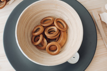 Bagels in a plate on the table. Delicious and appetizing in a light plate