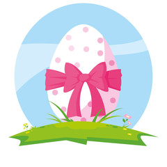 decorated easter egg with bow in grass