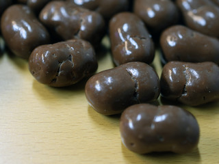 Puffed maize chocolate candies on the table. Copy space.