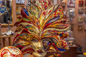 Italy, Venice, carnival 2019, typical Venetian masks and costumes in shop windows and in the street.