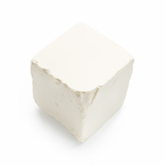 Feta cheese cube on white