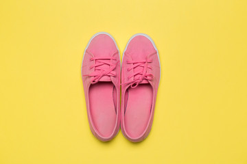 Pink Sneakers on yellow background. Photo. Interior poster