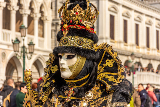 Italy, Venice, carnival 2019, typical masks, beautiful clothes, posing for photographers and tourists in Piazza San Marco.