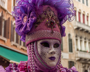Obraz na płótnie Canvas Italy, Venice, carnival 2019, typical masks, beautiful clothes, posing for photographers and tourists in Piazza San Marco.