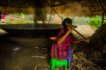 woman making  vellam 