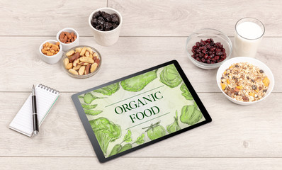 Fresh food on the table with a tablet PC.