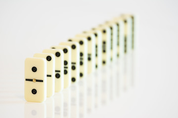 domino tiles in a row on a white background