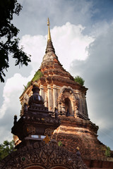 Wood entrance and pagoda in Chiang Mai Thailand