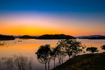 Fototapeta na wymiar Sunset at lake, Kaeng Krachan Dam on Silhouette