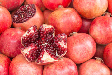 Pomegranate fruits, on the market counter