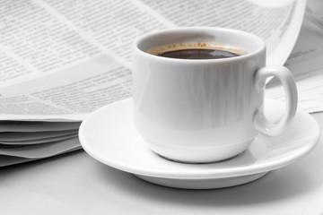 Newspaper  on table. Coffee break.
