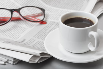 Newspaper  on table. Coffee break.