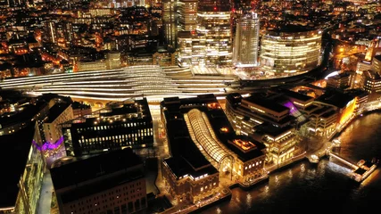 Fotobehang Aerial drone panoramic night shot of iconic financial district over river Thames in City of London, United Kingdom © aerial-drone