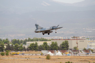 Fototapeta premium Delta wing fighter landing airbase