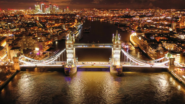 Aerial drone high resolution night photo of iconic Tower Bridge in the heart of City of London, United Kingdom