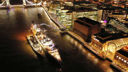 Aerial drone panoramic night shot of iconic financial district over river Thames in City of London, United Kingdom