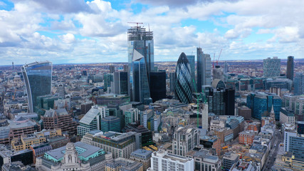 Fototapeta na wymiar Aerial drone panoramic view of iconic financial and bank district with tall skyscrapers in City of London, United Kingdom