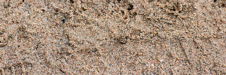 Background of sand with a trace of shoes