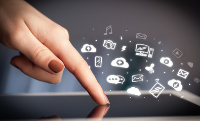 Hand holding tablet with social media concept
