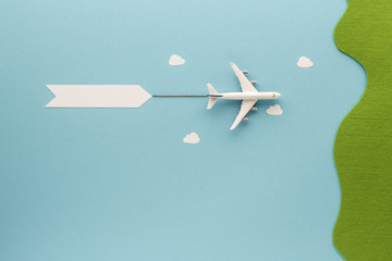airplane flying over blue sky with clouds  top view with copy space for your text. flat lay. 