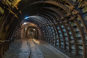Fototapeta na wymiar Underground corridor in an old gold mine and arsenic