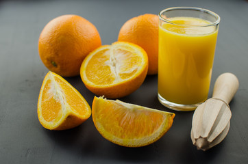 Fototapeta na wymiar Orange juice on a black background