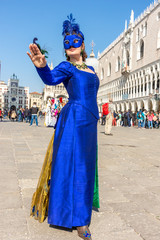 Fototapeta na wymiar Italy, Venice, carnival, 2019, masked people roam the city, posing for photographers and tourists, with beautiful clothes.