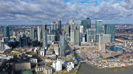 Fototapeta na wymiar Aerial bird's eye panoramic photo taken by drone of iconic Canary Wharf skyscraper complex and business district, Isle of Dogs, London, United Kingdom