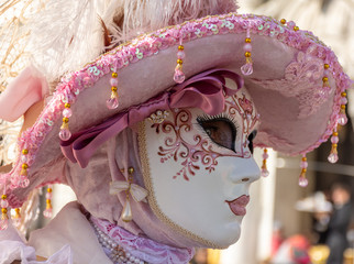 Italy, Venice, carnival, 2019, masked people roam the city, posing for photographers and tourists,...