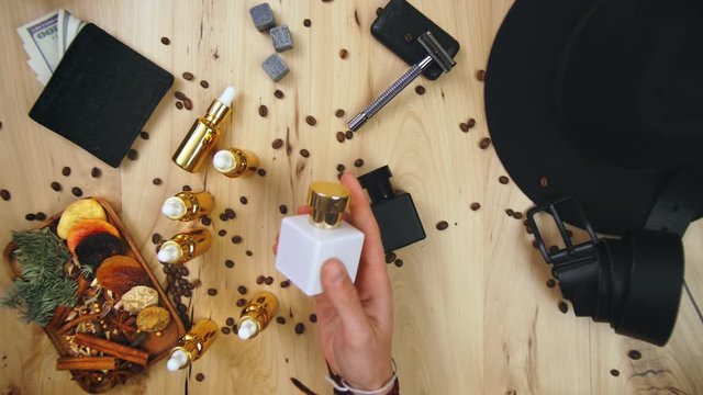 Male perfumer demonstrating his fragrance