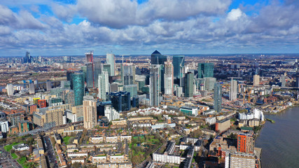 Aerial bird's eye panoramic photo taken by drone of iconic Canary Wharf skyscraper complex and...