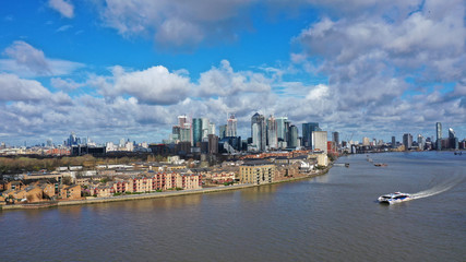 Aerial bird's eye panoramic photo taken by drone of iconic Canary Wharf skyscraper complex and...