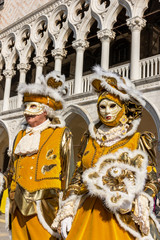 Italy, Venice, carnival 2019, typical masks, beautiful clothes, posing for photographers and tourists.