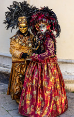Fototapeta na wymiar Italy, Venice, carnival 2019, typical masks, beautiful clothes, posing for photographers and tourists.