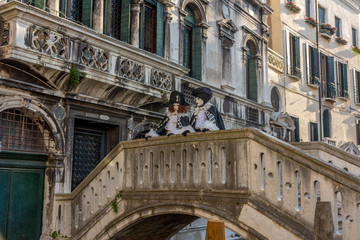 Italy, Venice, carnival 2019, typical masks, beautiful clothes, posing for photographers and tourists.