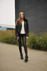 beautiful girl walking in stylish clothes