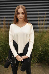 beautiful girl walking in stylish clothes