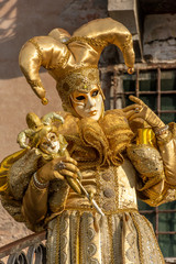 Obraz premium Italy, Venice, carnival 2019, typical masks, beautiful clothes, posing for photographers and tourists.