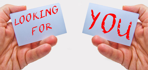 Job recruiting advertisement represented by 'LOOKING FOR YOU' texts