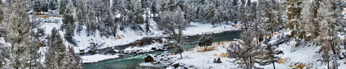 The blue waters of a river flow through a panorama
