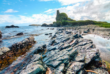 Rock layers at an intertidal zone as seen on a sunny day on the island of Islay, Scotland, UK.