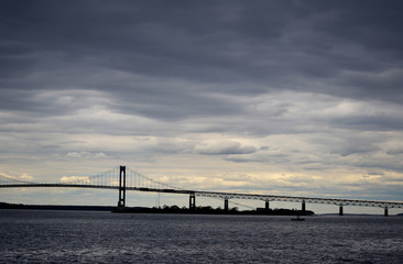 Fototapeta na wymiar Stormy Skies Over a Long Bridge