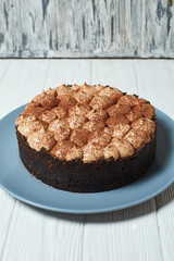 Vanilla cheesecake with milk chocolate cream and cocoa