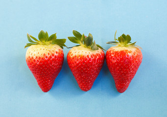Three strawberries in a row