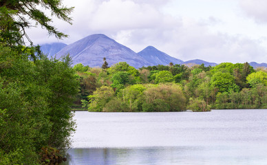 The Paps of Jura, large mountains on the island of Jura in Scotland, are seen from Loch Ballygrant...