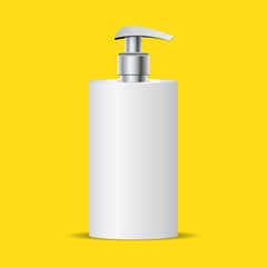 bottle of liquid soap with metal pump isolated on yellow background