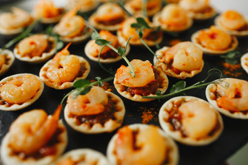 luxury tartlets with shrimp for dinner in the restaurant, catering