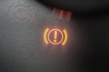 Handbrake warning light sign illuminated close up