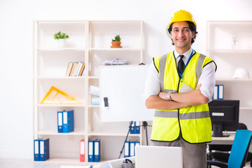 Male construction engineer working in the office