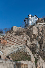 Fototapeta premium Old House and Ruins of Roman theatre of Philippopolis in city of Plovdiv, Bulgaria